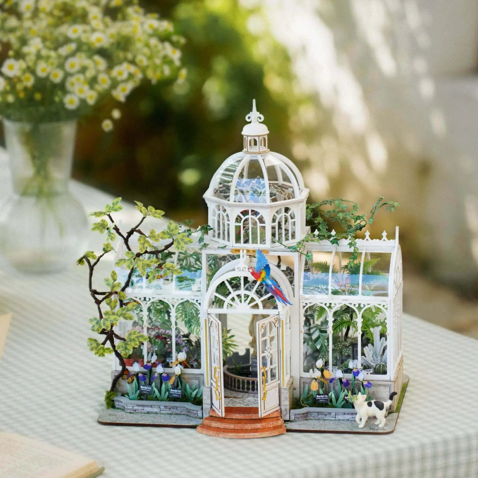Completed Rolife Oxygen Oasis DH102 miniature greenhouse with plants, parrot and cat figure