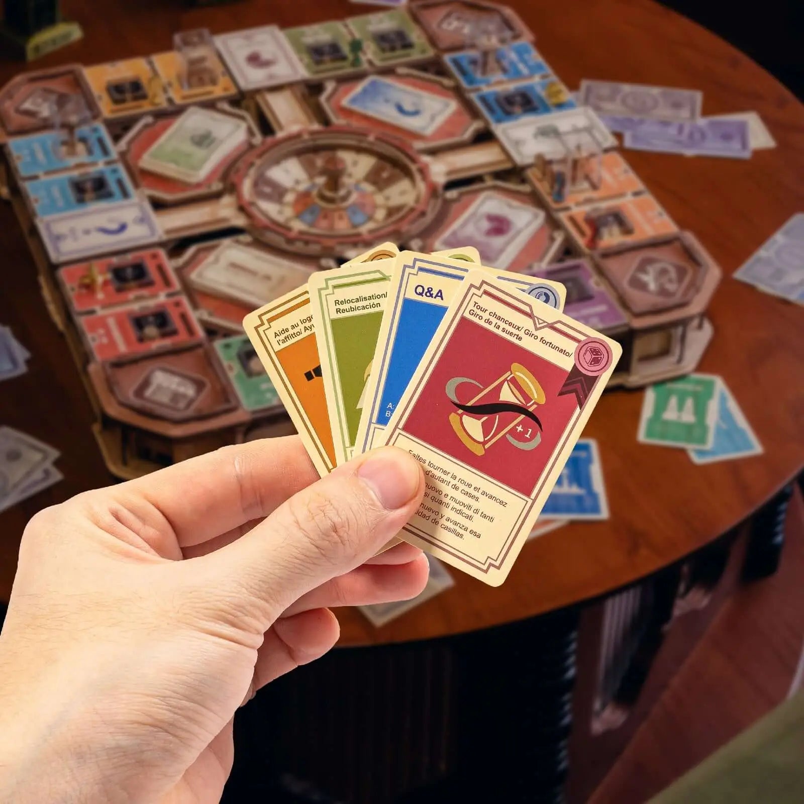 Fortune Quest action and question cards held in front of the assembled wooden game board