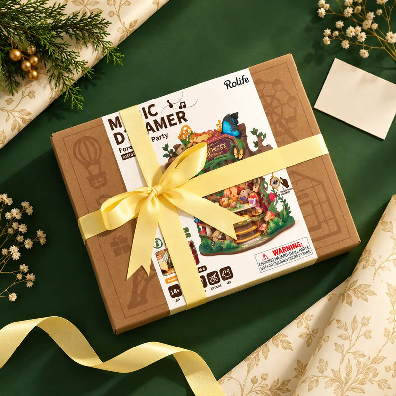 Rolife Forest Tea Party AMT03 kit box styled with ribbon and cream wrapping paper on a green background