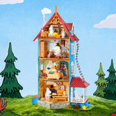 Open Rolife Moominhouse miniature showing four furnished floors and Moomin characters in a woodland scene