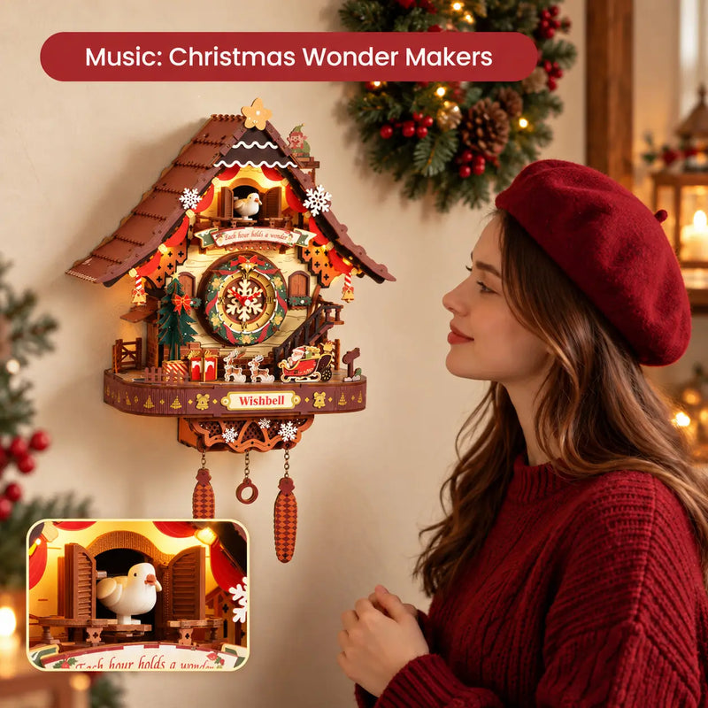 Woman admiring the illuminated ROKR LCB01 wall clock with Santa’s sleigh, a cuckoo detail inset and the caption “Music: Christmas Wonder Makers”.