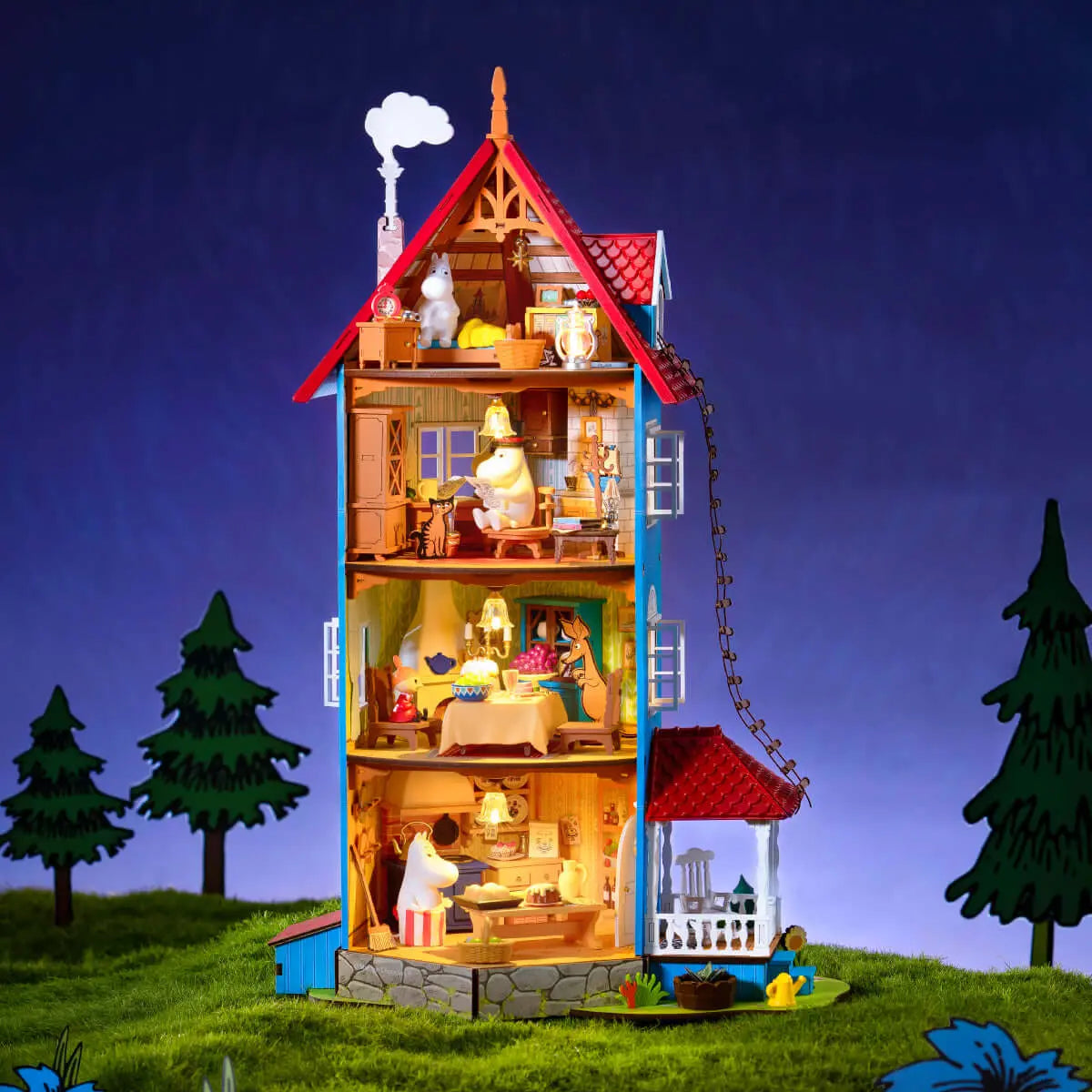 Rolife Moominhouse miniature at night with warm lights illuminating its four interior floors