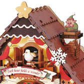 Close-up of the cuckoo bird, illuminated window, snowflake roof detail and chimney elf on ROKR LCB01