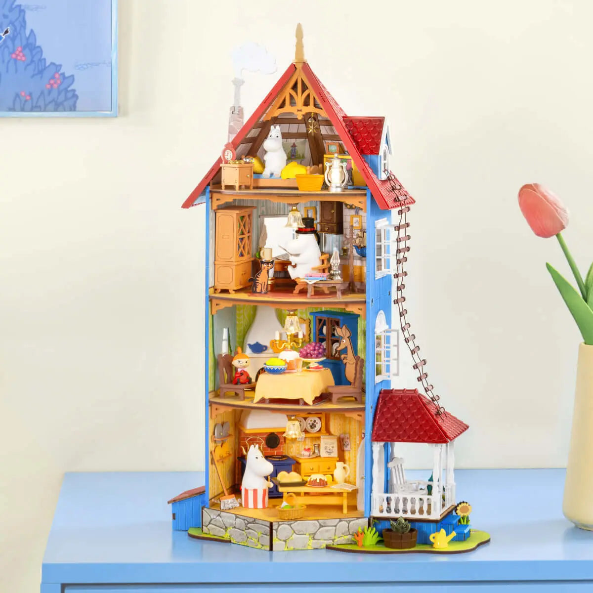 Completed Rolife Moominhouse miniature displayed on a tabletop with its furnished rooms open