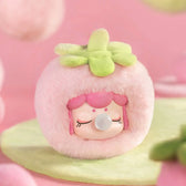 Strawberry Nanci plush pendant on a soft pink background