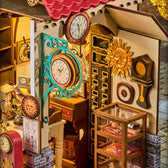 Rolife Clockwise Clocks DH104 detail showing a turquoise clock frame, golden sun ornament and glass display cabinet.