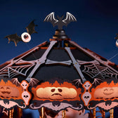 Close-up of the Phantom Waltz canopy with cobwebs, glowing pumpkin faces, skull trim and one-eyed bats.