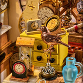 Rolife Clockwise Clocks DH104 workshop detail with a copper-coloured bird, an hourglass, miniature clocks and a blue jug.