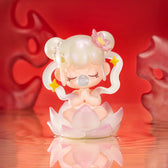 Best of Luck Nanci figure meditating on a translucent pink lotus