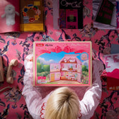 Rolife Fairy Rose Cottage HH001 kit packaging in a pink bedroom