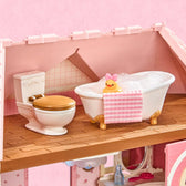 Fairy Rose Cottage attic bathroom with bathtub, toilet, towel and duck