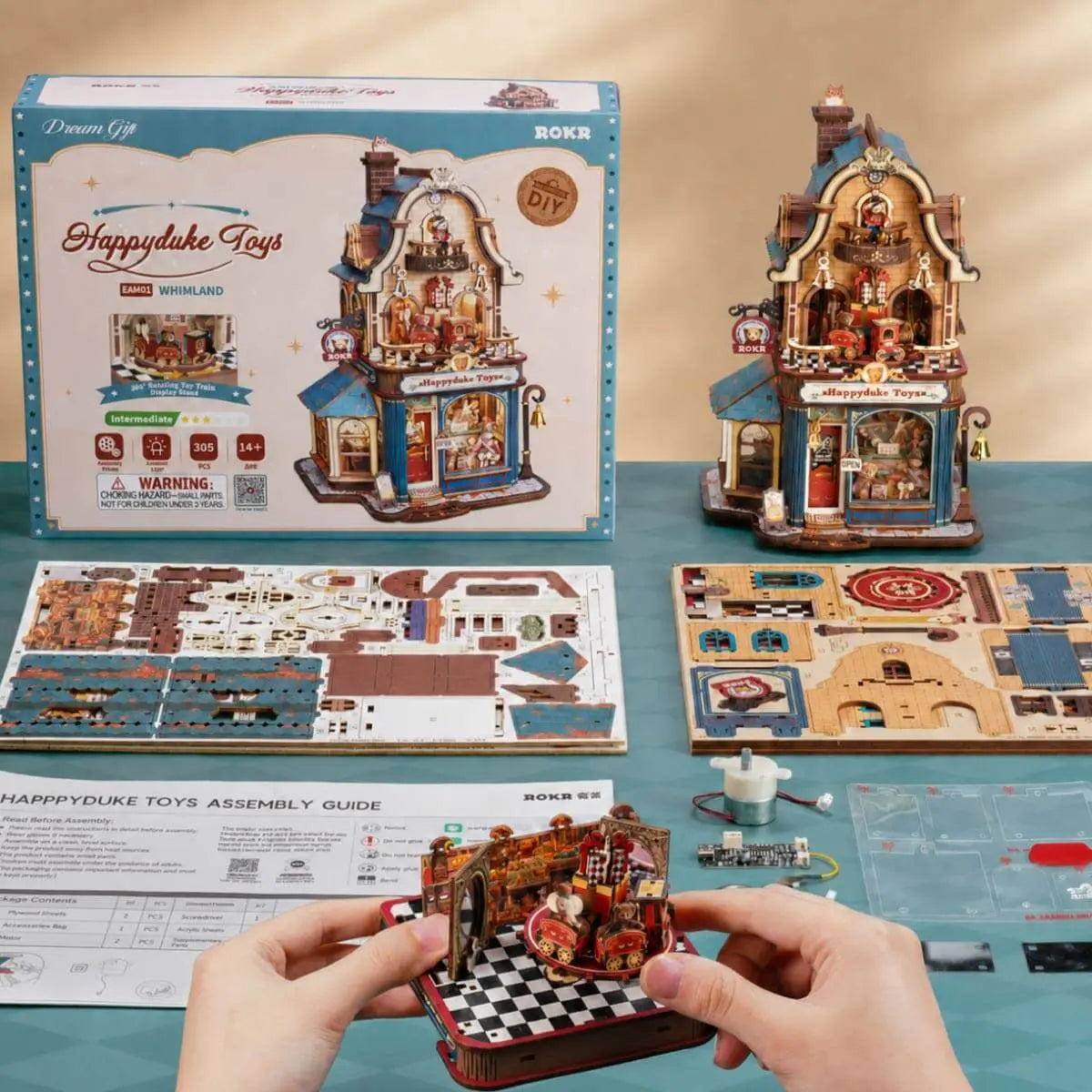 ROKR Happyduke Toys EAM01 kit contents with 305 pieces, instructions, packaging and completed model