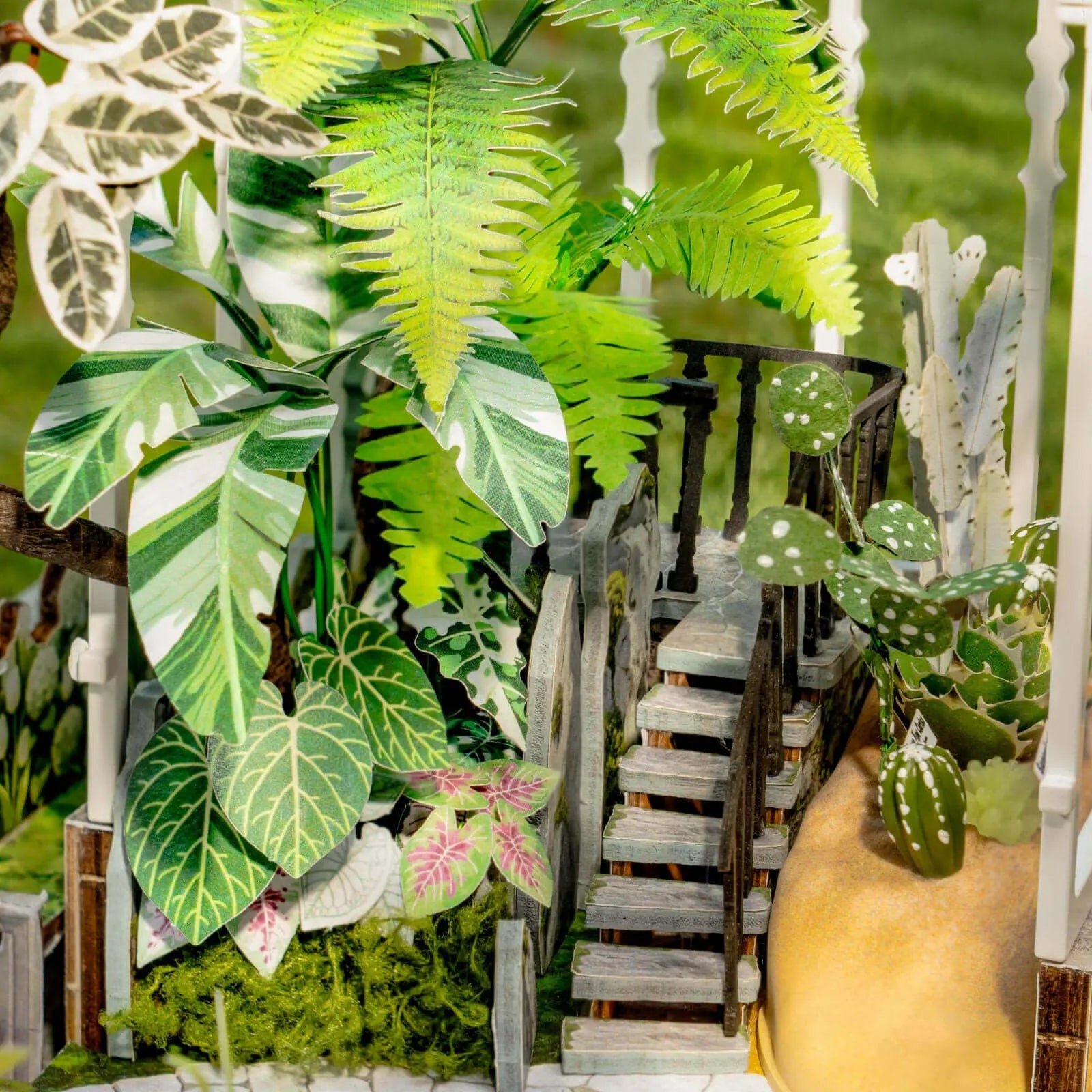 Miniature stairway surrounded by tropical plants inside Rolife Oxygen Oasis DH102