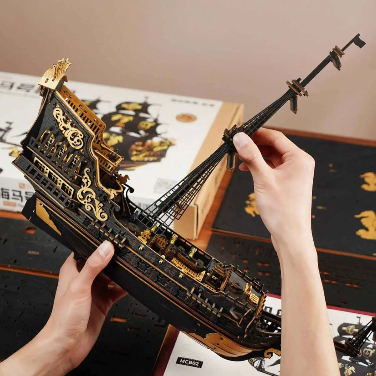 Hands assembling The Seahorse Barque 3D Wooden Puzzle