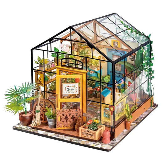 Cathy’s Flower House DIY Miniature Kit – a charming, handcrafted greenhouse model with plants, lights, and furniture.