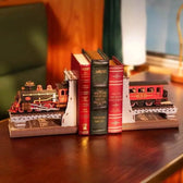 Completed Century Train train bookends displayed on a wooden desk with books in the centre