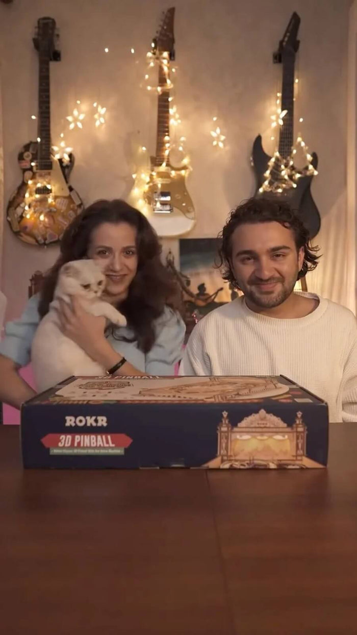 Couple preparing to build the ROKR Pinball Machine EG01 3D wooden puzzle kit