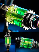 Close-up of vivid green liquid-filled core on Emerald Mantis mechanical metal model