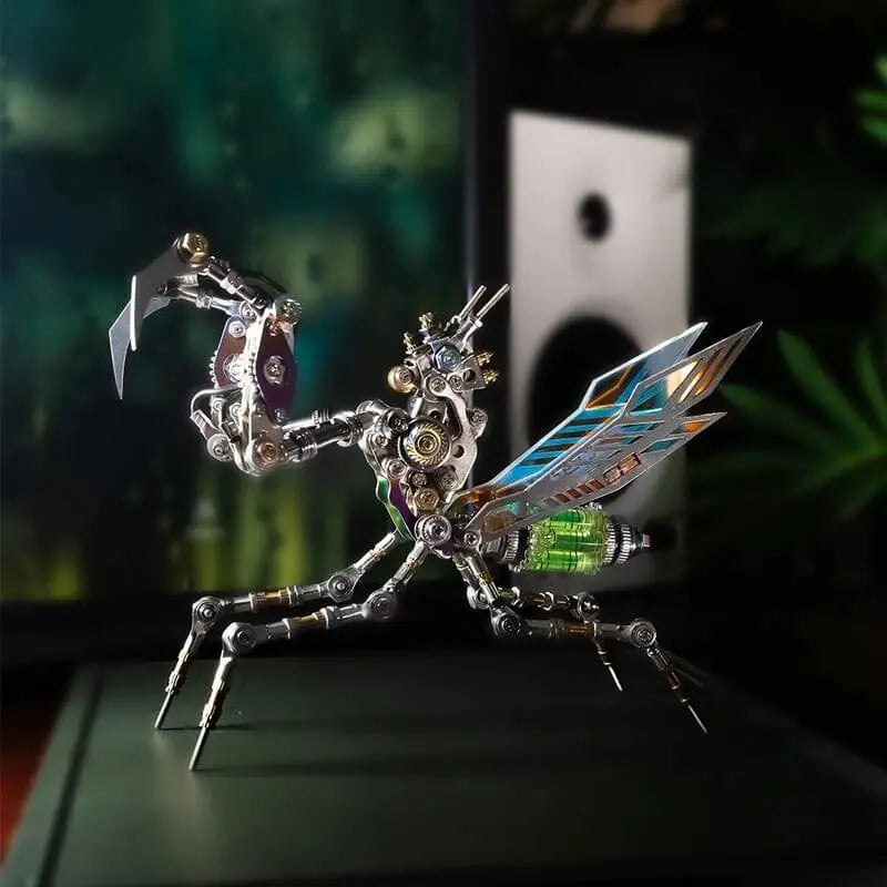 Emerald Praying Mantis metal model displayed indoors with articulated legs and iridescent wings