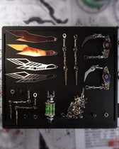 Emerald Mantis model kit parts with instruction guide, screwdriver and needle-nose pliers