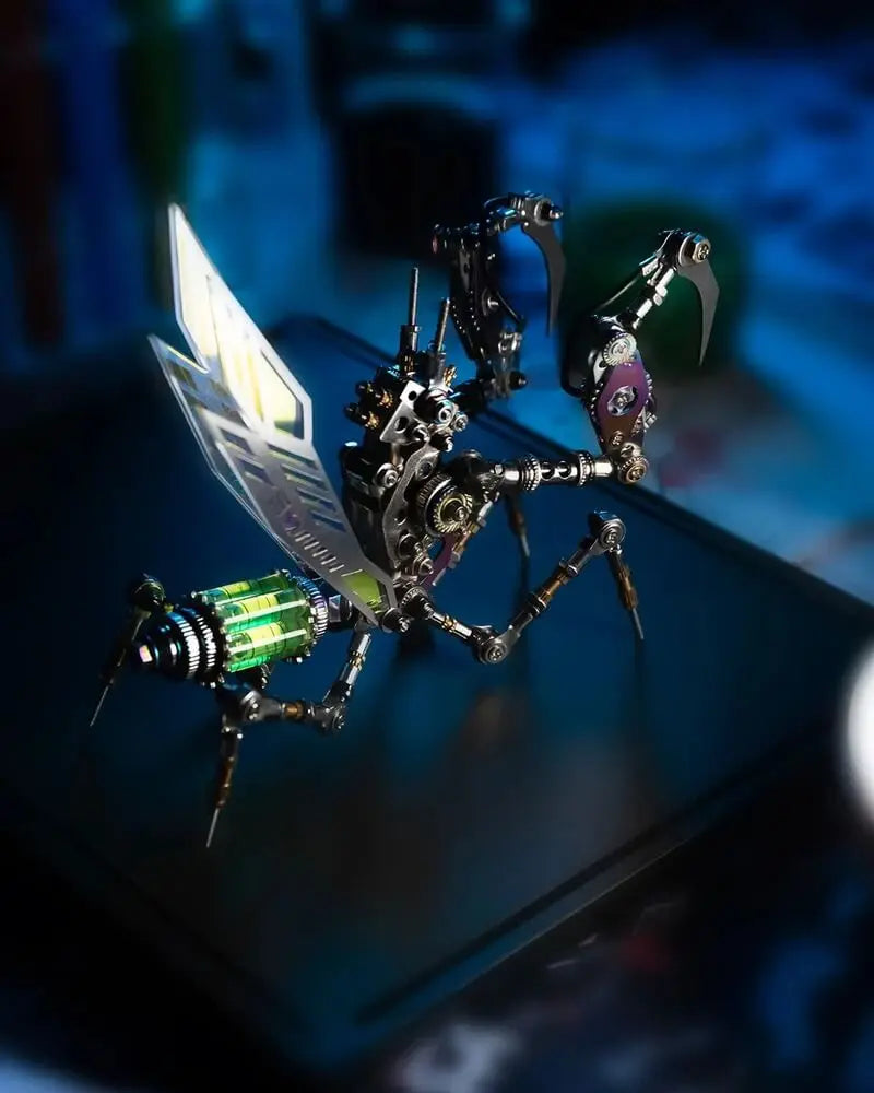 Rear view of Emerald Mantis mechanical model showing raised forelegs, wings and vivid green core