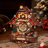 ROKR LCB01 Christmas cuckoo clock glowing on a wooden tabletop with a Christmas tree and gifts in the background.