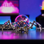 Front view of the Mostarle Plasma Ball Spider metal model with red illuminated eyes and a glowing purple plasma ball.