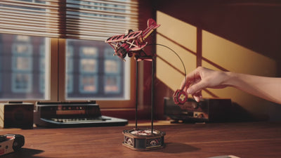 Wooden Airplane Pendulum Toy demonstrating gravity-powered balance