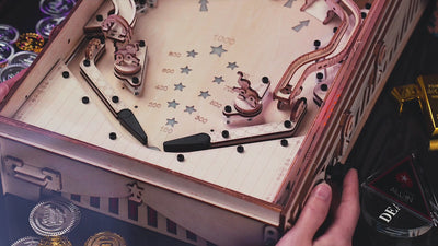 ROKR EG01 wooden pinball machine steel ball hitting scoring targets on the playfield