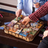 Players using the central marble spinner on the ROKR Fortune Quest wooden board game