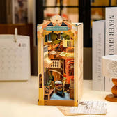 Completed Rolife Venice book nook displayed on a desk beside books and home décor