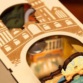 Angled view through the decorative arch of the layered Romantic Venice canal scene