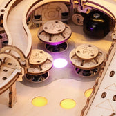 Close-up of illuminated rebound bumpers inside the wooden pinball machine upper playfield