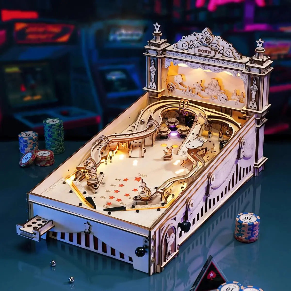 Wooden pinball machine illuminated in a retro arcade setting with ramps, bumpers and scoring playfield