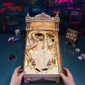Hands playing the wooden pinball machine tabletop game with illuminated tracks, flippers and scoring targets